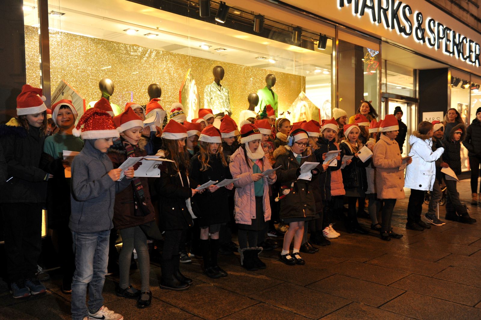 Carol singers during late night shopping event