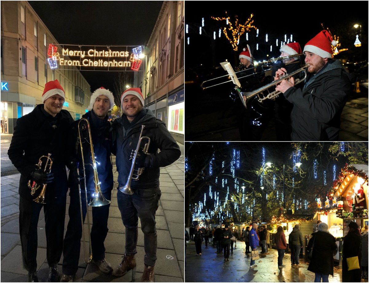 Musicians underneath Merry Christmas illuminated sign and playing instruments