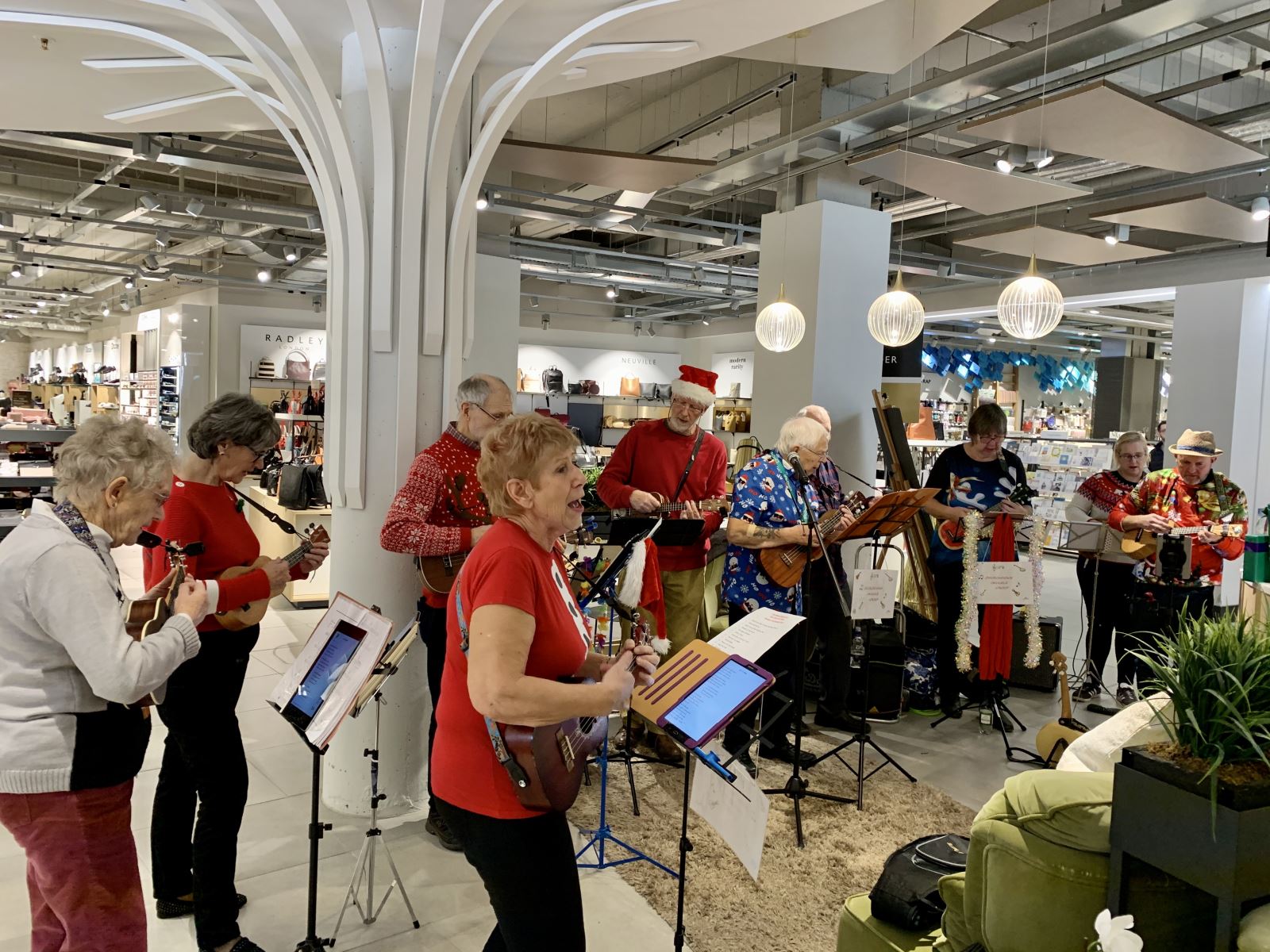 Band playing instruments inside John Lewis