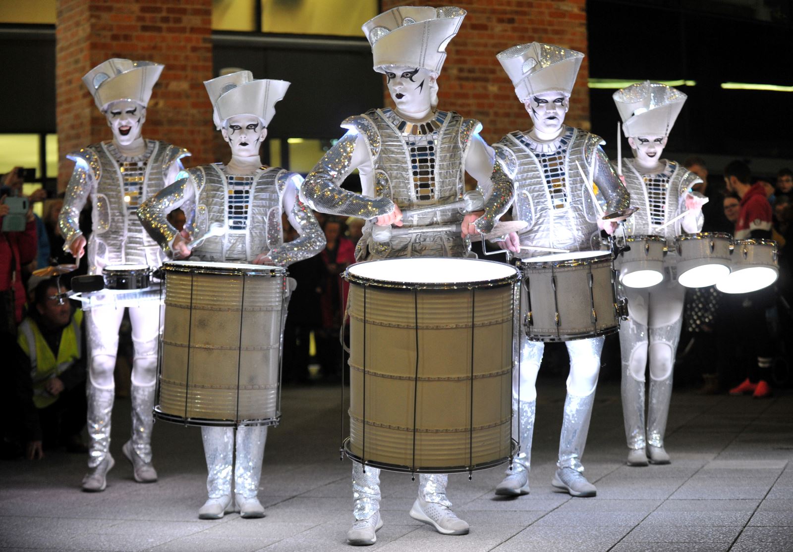 Spark! street performers illuminated with drums in Cheltenham