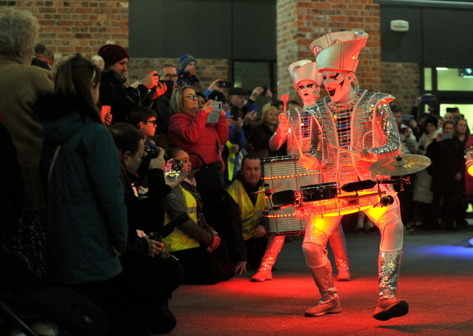 Spectators enjoying Spark! drumming performers in Cheltenham