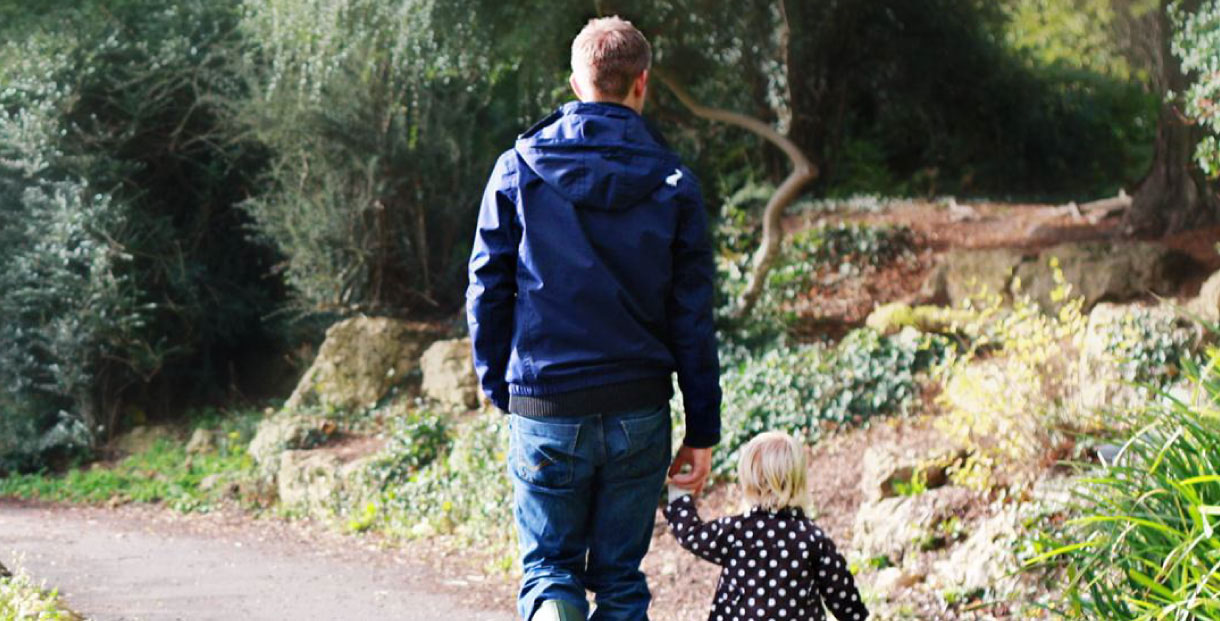 Dad walking with child 