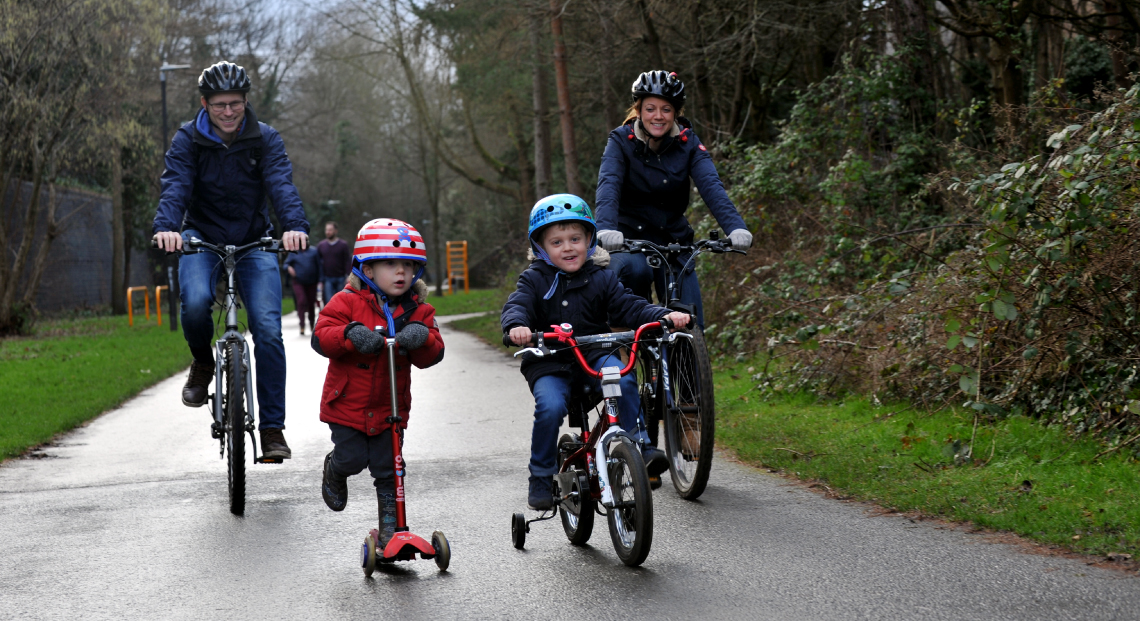 Family riding bikes in Cheltenham