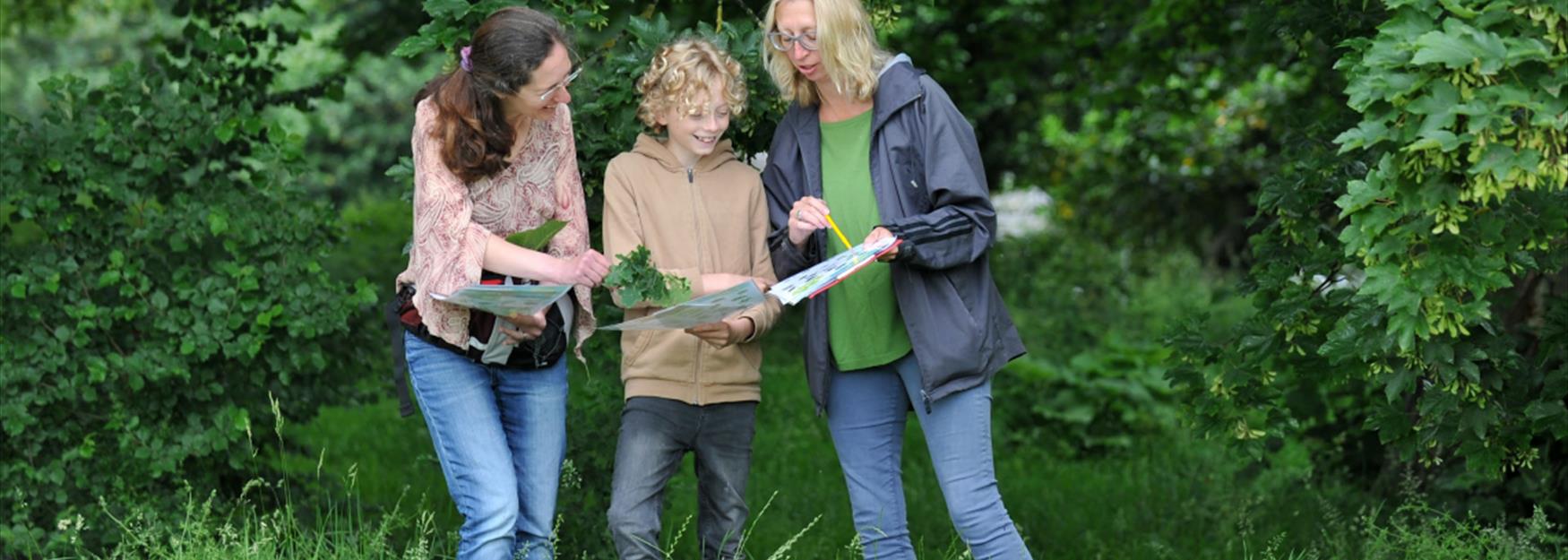 Family following a nature trail in Cheltenham