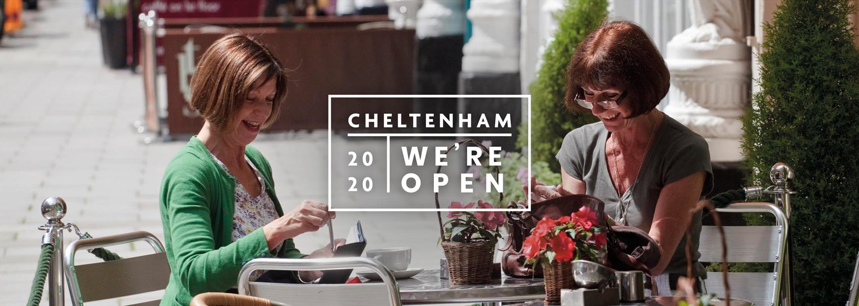 Two ladies dining al fresco with text saying Cheltenham, we're open