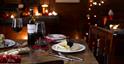 Table set for Christmas with cheese and red wine