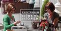 Two ladies dining al fresco with text saying Cheltenham, we're open