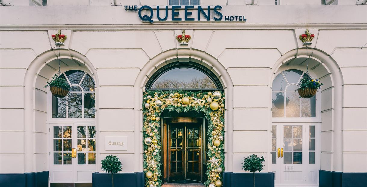 Queens Hotel exterior with Christmas decorated entrance