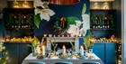 Set dining table with candles and Christmas decorations.