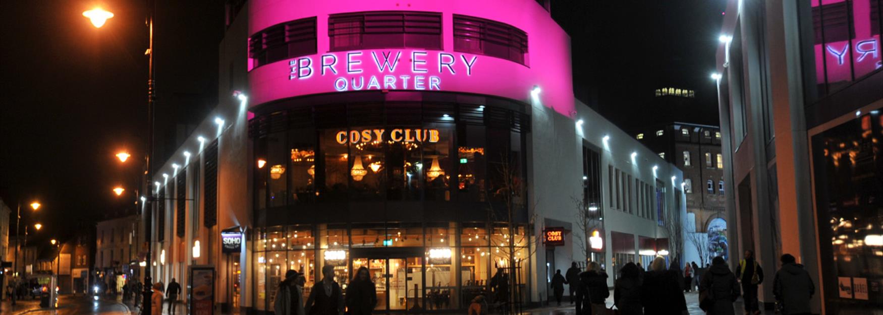 The Brewery Quarter lit up at night